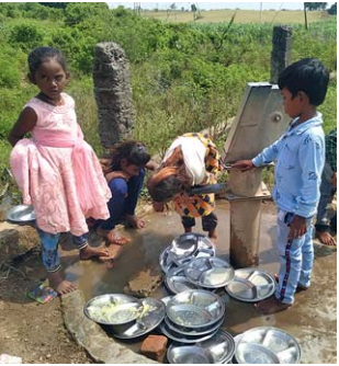 Children Drinking Water Through Handpump