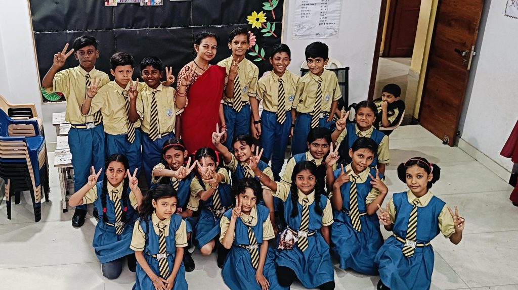 Class 2024-25 students with teacher neetu yadav dps