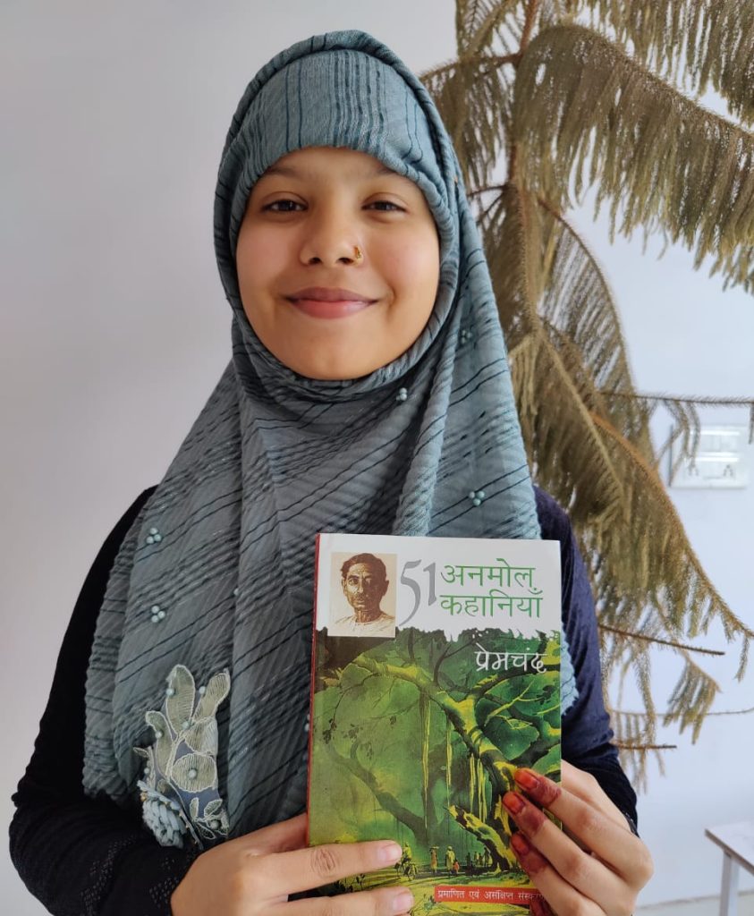 Alisha Sidduiqui Holding Book