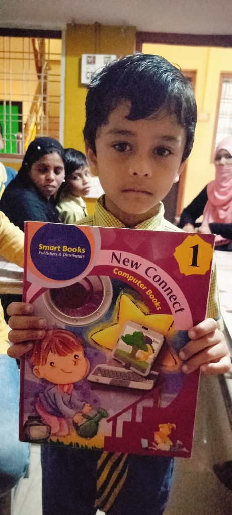 Ahmad Class 1st Student Holding Book