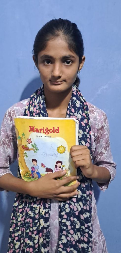 Alisha CFC student Holding Book