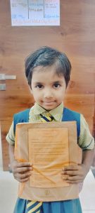 Amayra Class 1st Student Holding Book