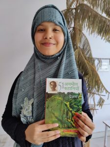 SDC Student Holding Book