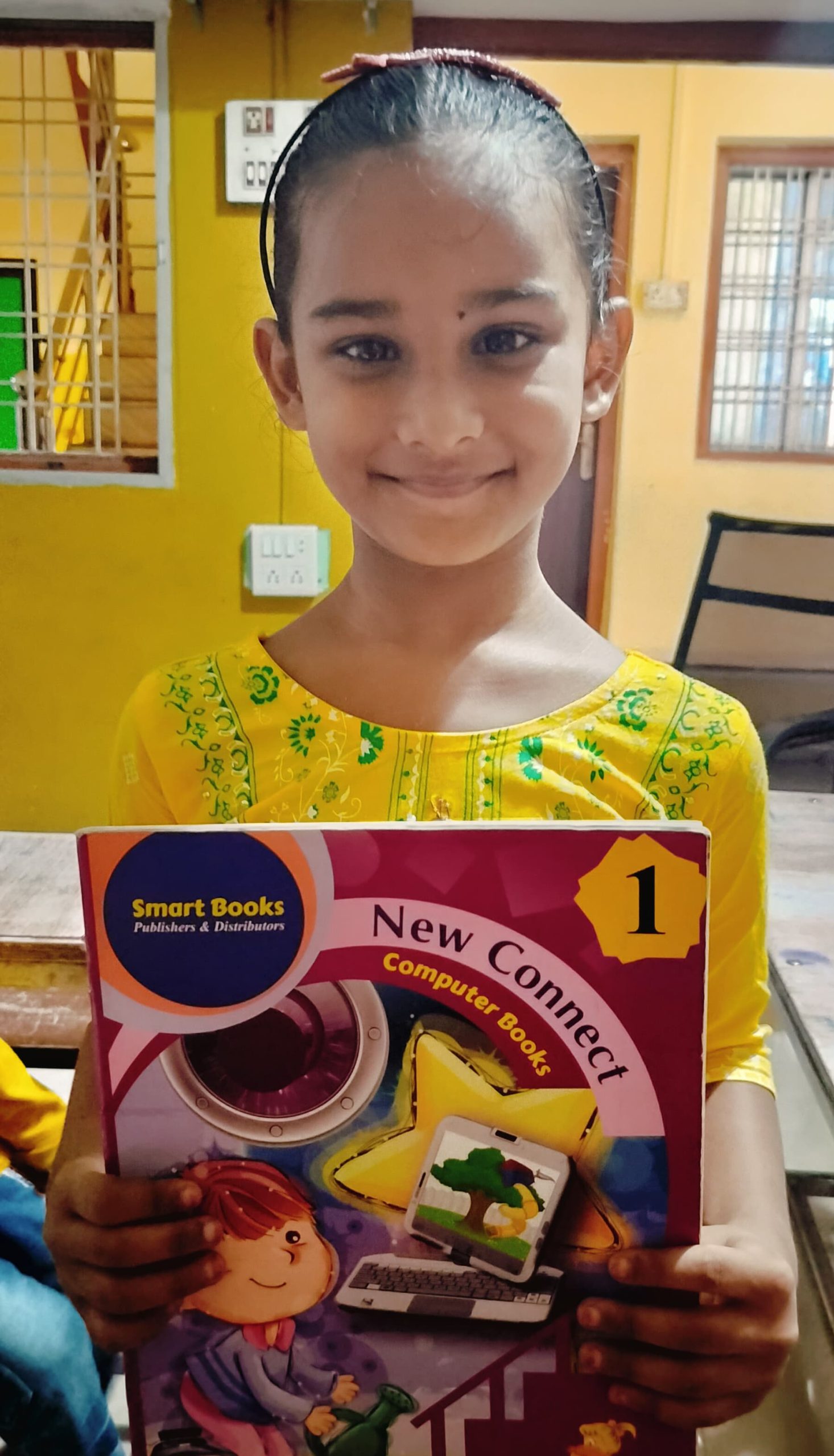 Aliya Class 1 st Student Holding Book