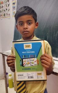 Shaami Class 1 st Student Holding Book