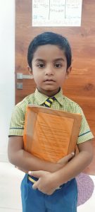 Muaaz Class 1 st Student Holding Book