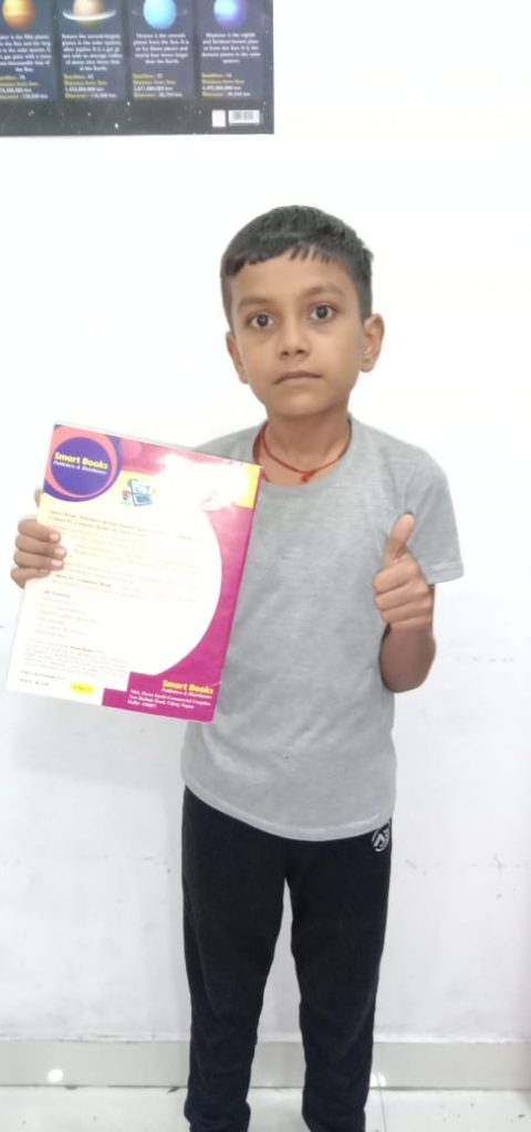 Rahul CFC Student Holding Boook