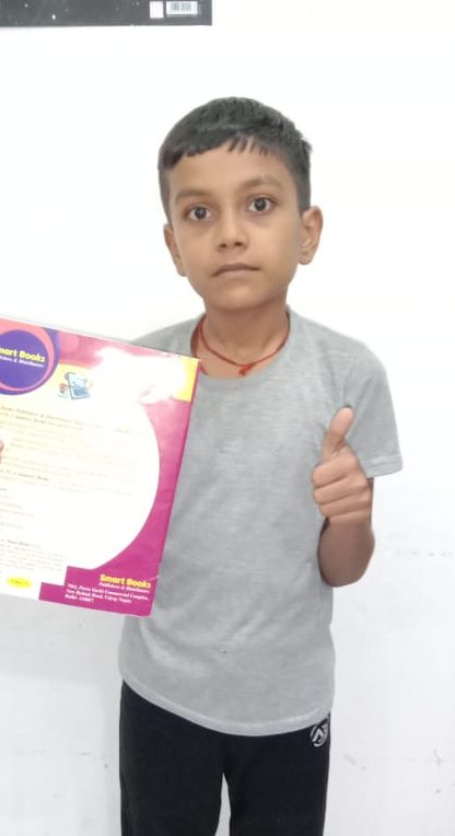 Rahul CFC Student Holding Boook