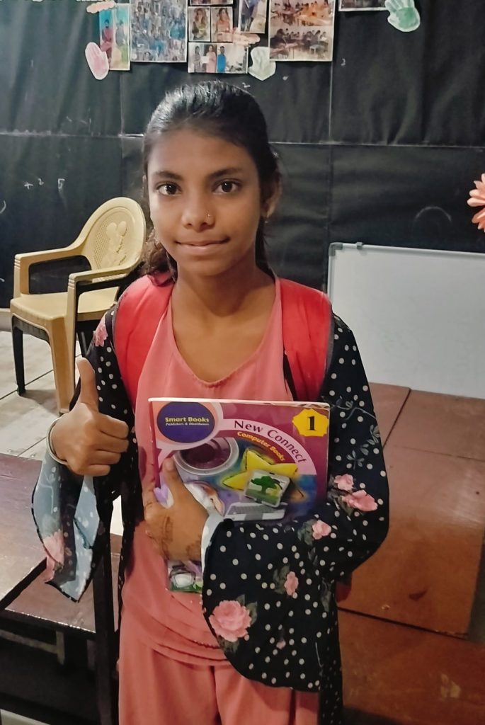Shadaf FSG Student Holding Book